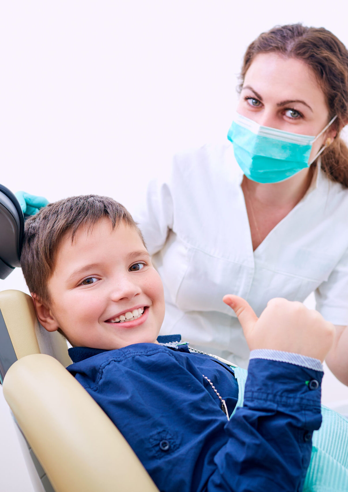 Child with doctor in the office shows thumb .