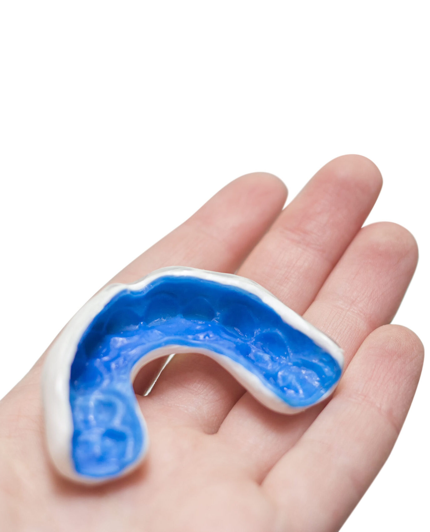 Hand with white sport mouthguard