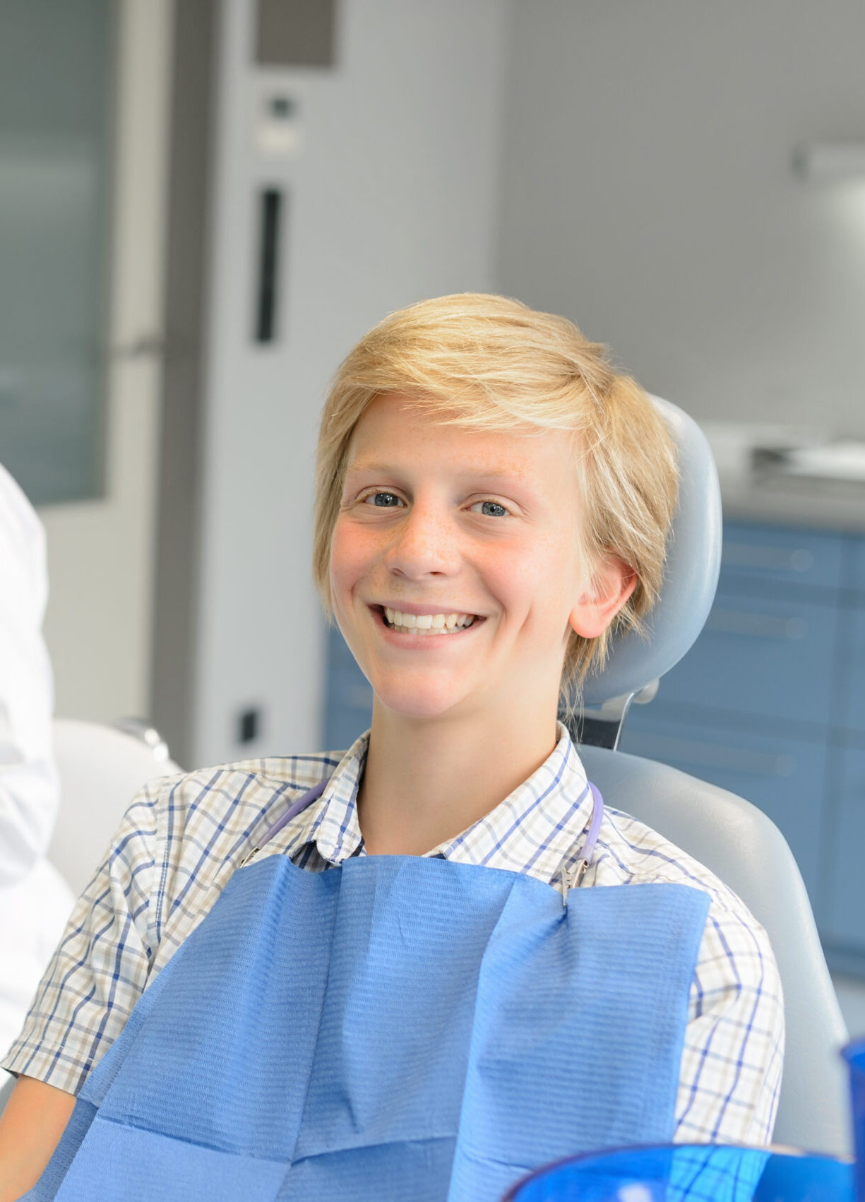 Dental checkup teenage patient boy and dentist nurse at stomatology clinic